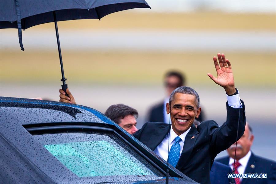 U.S. President Barack Obama(R) arrives at the Jose Marti International Airport in Havana, capital of Cuba, March 20, 2016.