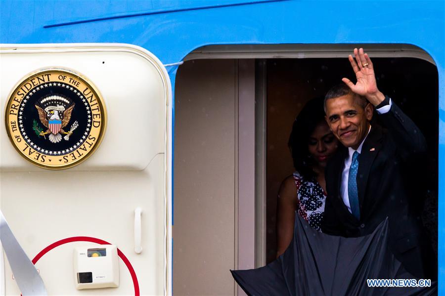 U.S. President Barack Obama(R) arrives at the Jose Marti International Airport in Havana, capital of Cuba, March 20, 2016.