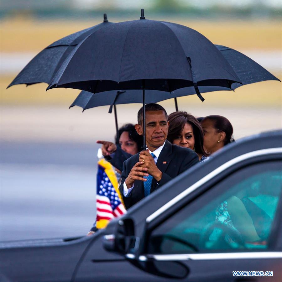 U.S. President Barack Obama(R) arrives at the Jose Marti International Airport in Havana, capital of Cuba, March 20, 2016.