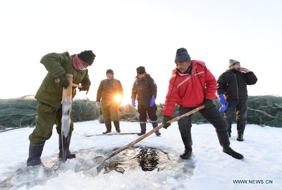 Winter fishing on a lake in northwest China – Xinhua English.news.cn