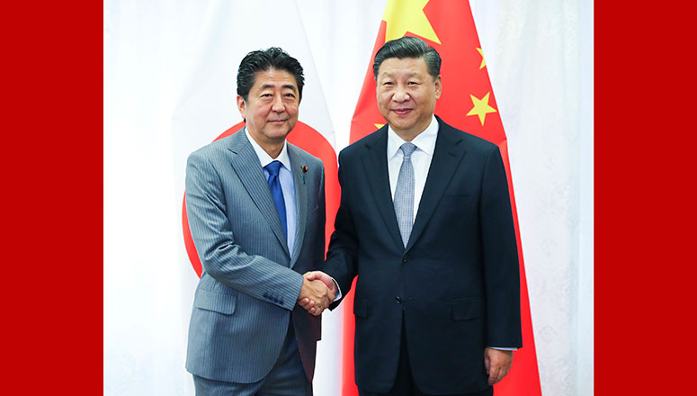 Xi et Abe évoquent l'amélioration des liens sino-japonais