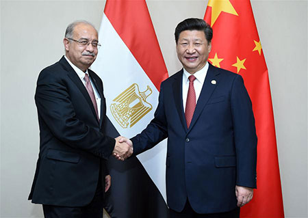 Xi Jinping appelle à intensifier la coopération dans le renforcement des capacités 
de production et la sécurité avec l'Egypte